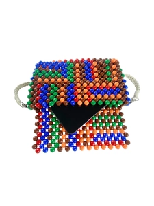 Colorful handmade beaded crossbody bag with white woven strap and vibrant ethnic style beads