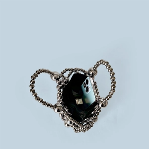 Interior view of silver beaded handbag showing black lining and phone storage capacity