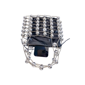 Detail of silver geometric hollow metal handbag with a black drawstring leather liner