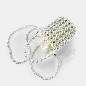 Detail of handmade pearl beaded bucket bag with drawstring satin lining and cross-body chain