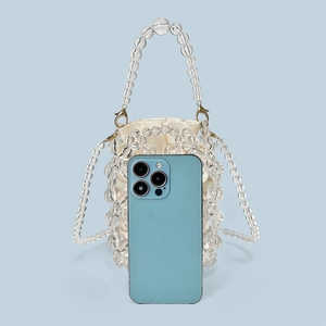 Detail of transparent beaded bucket bag showing internal capacity for a smartphone
