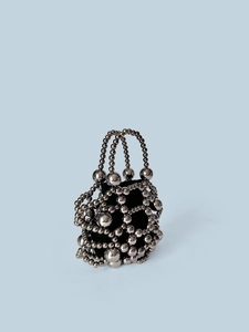 Sparkly metallic beaded handbag with a chic silver mesh design and black lining for party