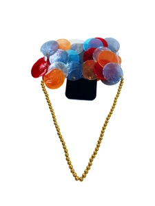 Detail of colorful acrylic sequins and golden beaded crossbody chain on phone case