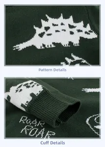 Detail of dark green knit sweater with dinosaur jacquard and ribbed cuff design