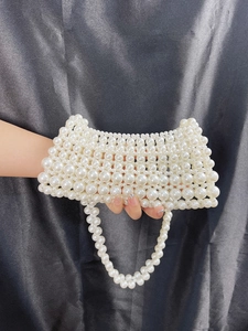 Elegant handmade pearl beaded evening bag with tiered pearls and a single shoulder strap