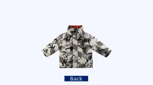 Detail view of children's camouflage padded jacket showing the reversible inner side