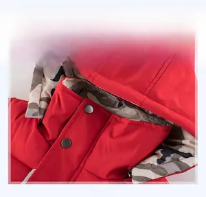 Detail of red hooded jacket showing windproof stand collar and camo lining detail