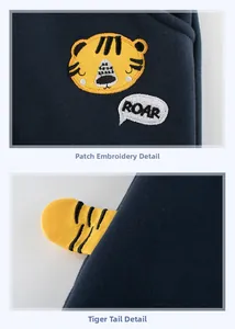 Pantalon enfant bleu marine avec broderie tigre jaune et détail de queue 3D ludique
