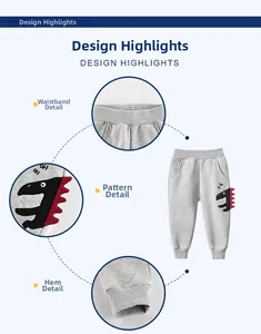 Detail of gray kids joggers with dinosaur applique, elastic waist, and ribbed cuffs