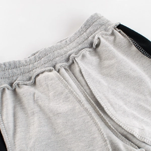Close-up of elastic waistband on grey toddler sweatpants with high-quality stitching