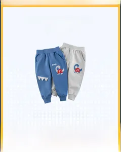Détails de pantalons de jogging pour enfants bleu et gris avec imprimé dinosaure