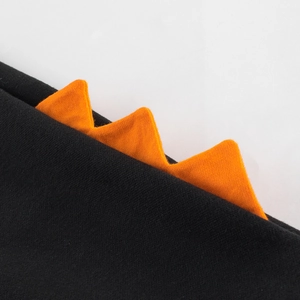 Kids black knit joggers with vibrant orange dinosaur spikes for stylish boys' spring wear
