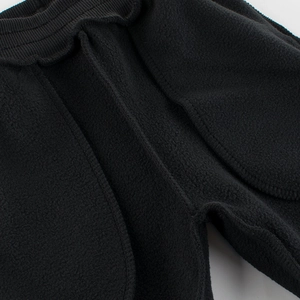 Kids black polar fleece joggers with elastic waistband and warm thermal lining
