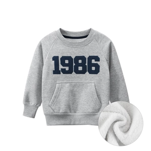 Kids grey fleece sweatshirt with 1986 print and soft warm inner lining detail
