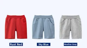 Flat lay of boys' cotton knit shorts in rust red, aqua blue, and heather gray colors