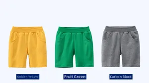Detail view of cotton knitted boys shorts in golden yellow, fruit green and carbon black