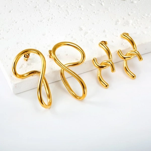 Minimalist irregular geometric gold earrings with polished mirror finish on stone base