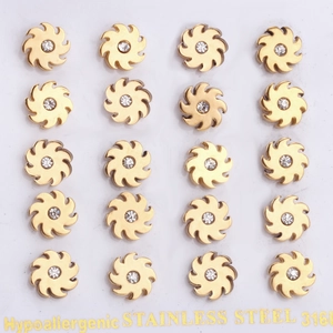 Detail showing 20 pieces of 316L stainless steel clover earrings with zircon centers