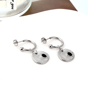 C-shaped stainless steel earrings with black shell pendants on a clean white background