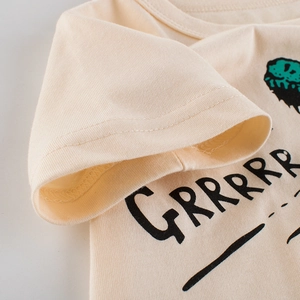 Kids cream cotton short sleeve T-shirt featuring a GRRRR dinosaur graphic print