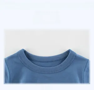 Detailed close-up of the ribbed crew neck and stitching on the blue cotton kids T-shirt