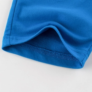 Close-up of royal blue knitted boys shorts showing durable double-needle stitching quality