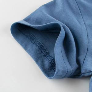 Detail shot of navy blue kids cotton T-shirt featuring ribbed cuffs and double stitching