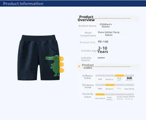 Detail of dark blue cotton shorts for boys featuring a green crocodile print and 3D spikes