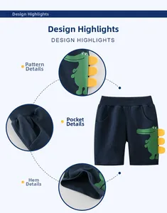 Detail of kids navy shorts featuring green crocodile print and 3D yellow felt scales