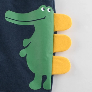 Navy blue kids shorts with green crocodile print and yellow felt detail on knit fabric