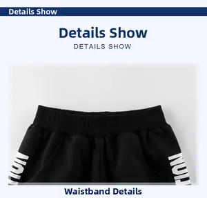 Elastic waistband detail on boys black cotton shorts with white letter print