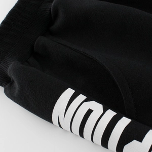 Boys' black knit cotton shorts with elastic waistband and bold side letter printing