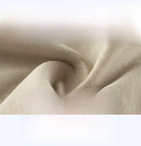 Close-up of soft breathable khaki knit fabric texture for boys summer mosquito pants