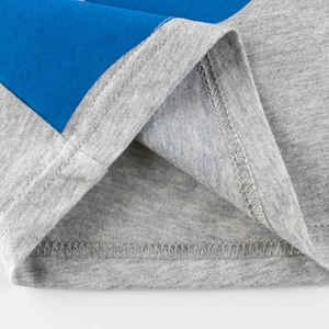 Kids grey t-shirt featuring navy blue panel stitching and durable reinforced hem