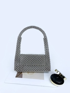Silver beaded handbag with metallic finish and top handle for elegant evening wear