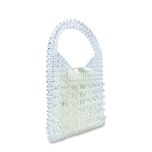 Detail of transparent beaded handbag with light gold satin drawstring inner pouch