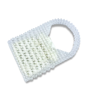 Detail of transparent beaded handbag with light green satin drawstring inner pouch