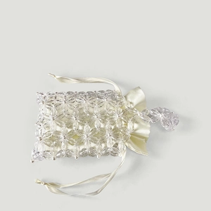Detail of handmade acrylic flower beads and satin drawstring lining on mini handbag
