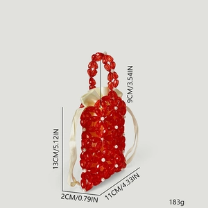 Detail view of red acrylic flower beaded bag with 13x11x2cm dimensions and pearl handle