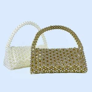 Detailed comparison of cream pearl and gold metallic beaded handmade shoulder handbags