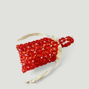 Detail of red acrylic flower beaded handbag with satin lining and pearl accents