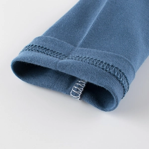 Kids long-sleeved t-shirt in navy blue showing reinforced cuff and knitting texture
