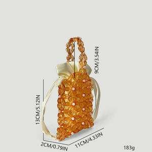 Detail showing amber acrylic flower beads with size annotations of the mini handbag
