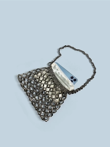 Silver metal chain link woven handbag with cream satin drawstring liner and smartphone interior