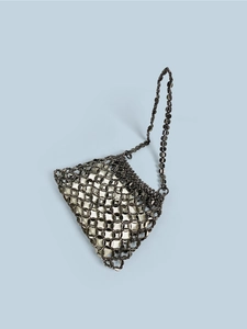 Detail of gunmetal sequin mesh shoulder bag with white satin lining and chain strap