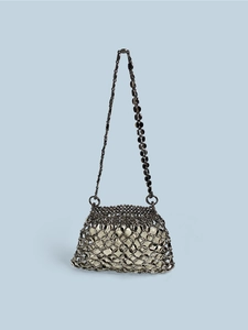 Macro view of gunmetal beaded mesh pattern with a cream fabric inner lining bag