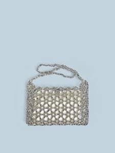 Detail of silver beaded shoulder bag with hollow mesh structure and inner pouch