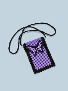 Close-up of handmade purple beaded phone bag with black bead bow accents and strap