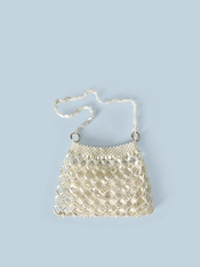 Detail of hand-woven white pearl beaded handbag with mesh pattern and shoulder strap