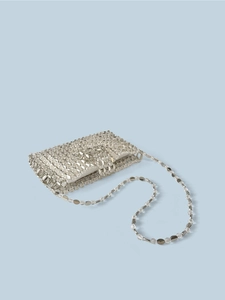 Detailed view of silver sequin woven mini bag with metallic discs and chain strap